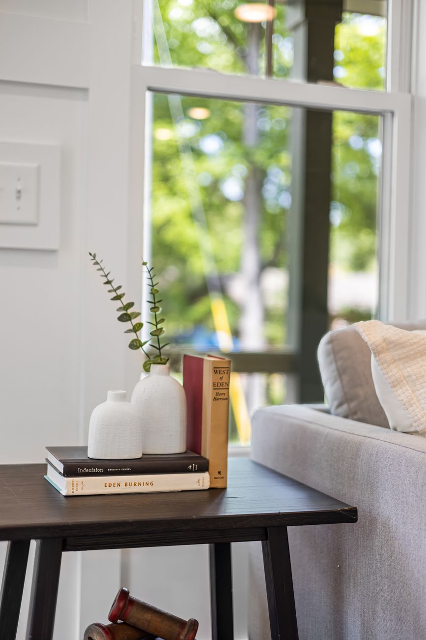 books and plants on table
